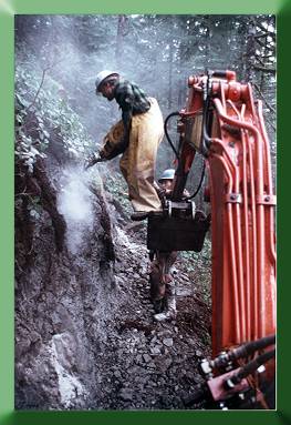 Robert Mitton drilling from Kubota bucket.