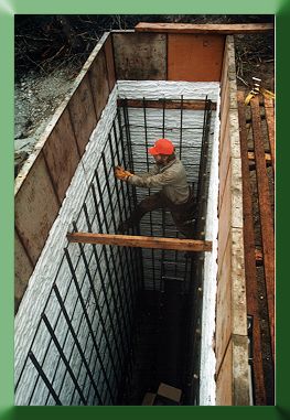 Russ Dalton working inside tower abutment form.  The white sheeting is a plastic form liner for texturing the concrete.