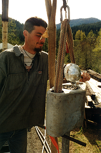 Keith Monohan pouring zinc into socket. 