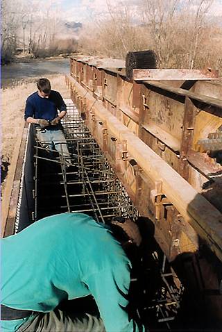 Tying rebar in abutment form.