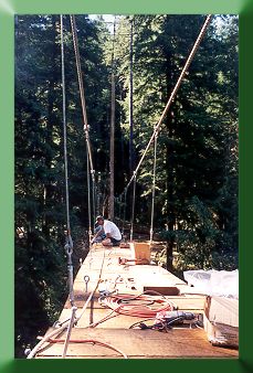 Kevin Monohan working on deck, 100' above Drift Creek