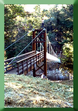 The finished bridge; Carroll Vogel on tower top