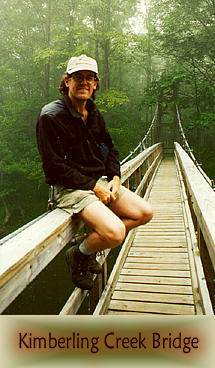 Builder Carroll Vogel visiting Kimberling Creek Bridge in 1995.
