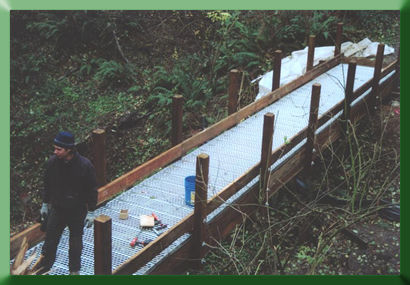 Railing is installed on Carkeek Bridge