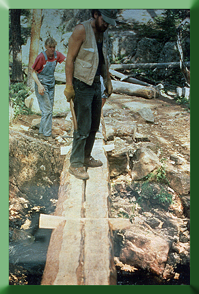 Alicia Spence and Carroll Vogel at Dillon Ranger District, CO, 1988. Solid stringer Wilderness bridge with dovetail deck splines.