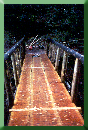Solid Stringer Bridge built at Kachess Campground, Cle Elum Ranger District, WA, 1989.  This is the largest solid stringer bridge built by Carroll Vogel and crew (overall length:  100').
