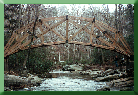 Prince William Forest Park, VA. This crescent truss bridge design was based on a bridge concept developed by Sir Isaac Newton for Cambridge University, England.